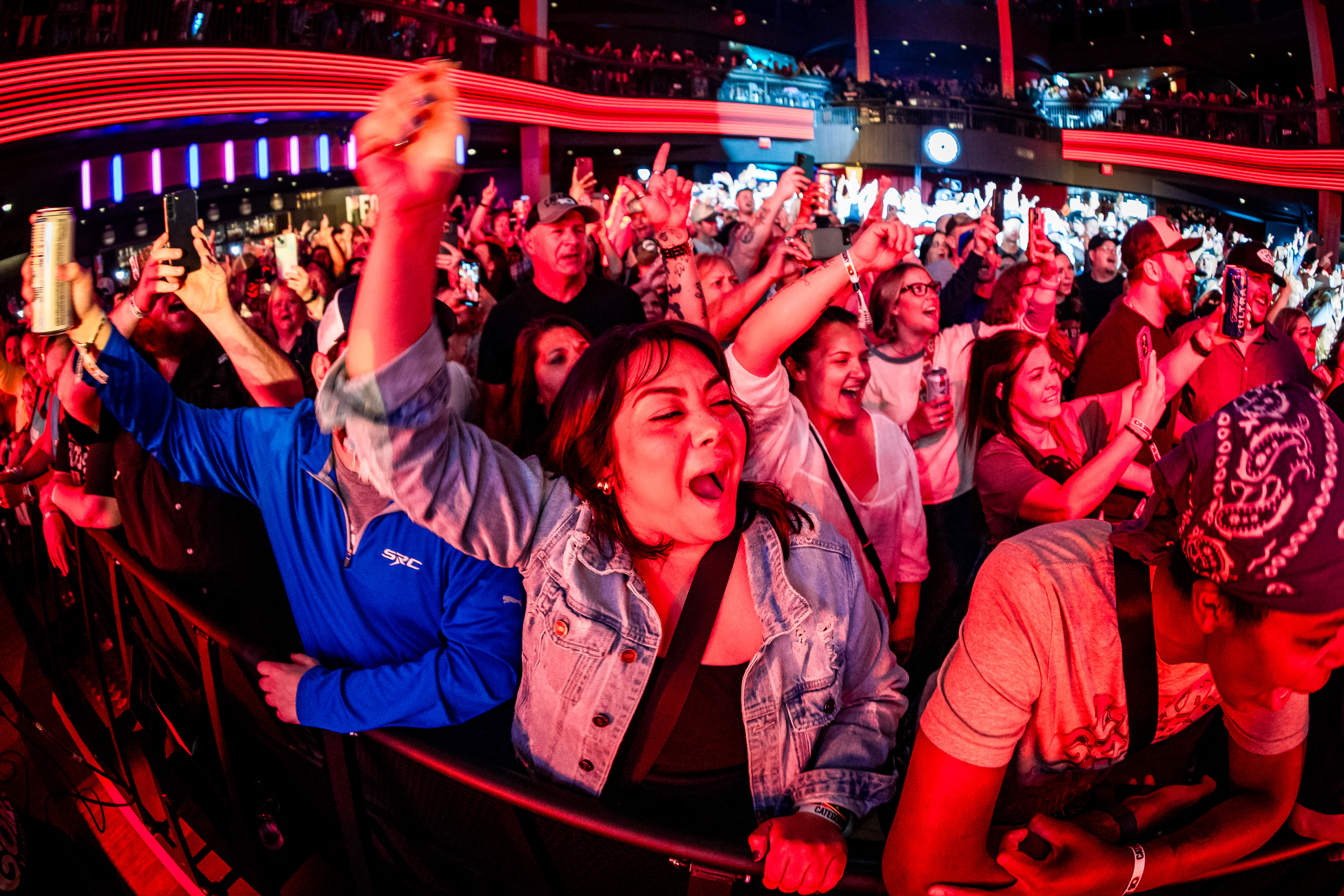 Fans cheering at a concert in Hurricane Hall